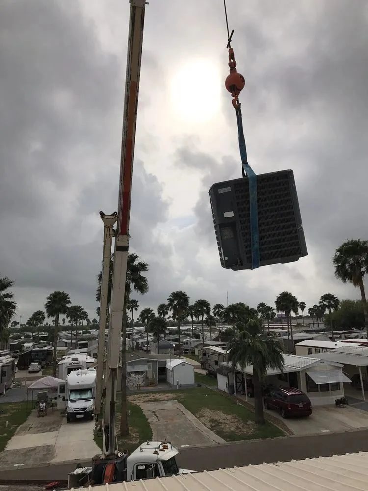 New AC unit lifted into place by Cool Aid Air Conditioning in Mission