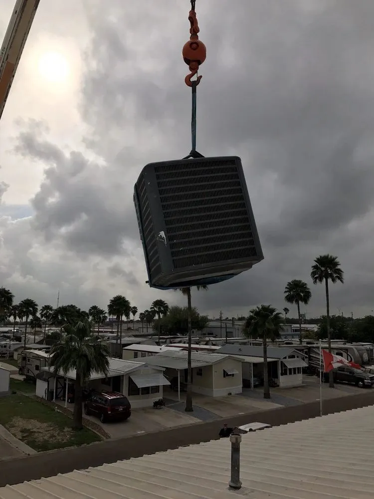 Old AC unit removed by Cool Aid Air Conditioning technicians